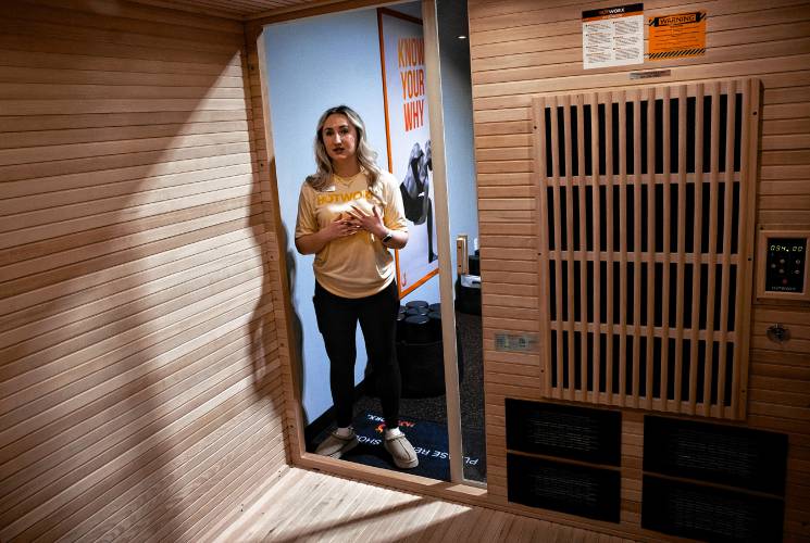 Co-owner Emily Lozada in one of the saunas at HotWorx on Loudon Road across the way from Buffalo Wild Wings. They held their grand opening on March 10.