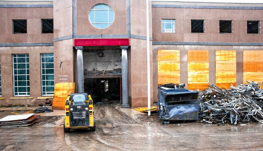 The demolition of the former Department of Justice building on North State Street is proceeding with piles of materials gathered outside the structure on Capitol Street side on Thursday, March 7, 2024.