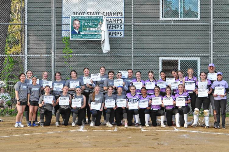 Franklin and Newmarket stand together on the night of Franklin's Strikeout Cancer game on Thursday May 16, 2024. 