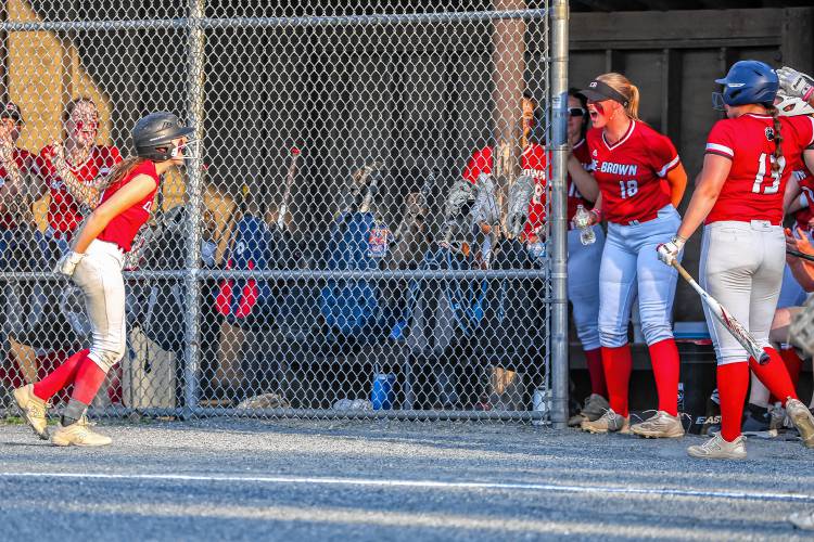 Haile Comeau (left) celebrates after scoring the first run of the game on a wild pitch in Coe-Brown's 4-0 D-II semifinal win over Bow on Tuesday, June 4, 2024.