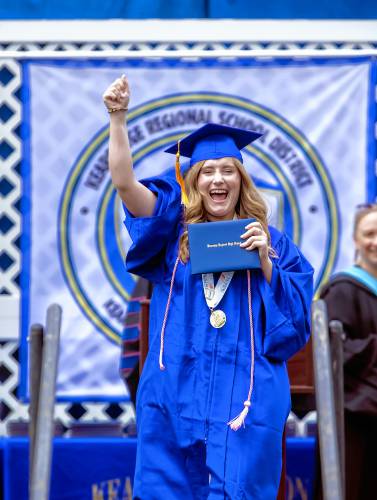 Kearsarge Regional High School graduate Brianna Thompson shouts to her friends in the audience after receiving her high school diploma at the school on Saturday, June 8, 2024.