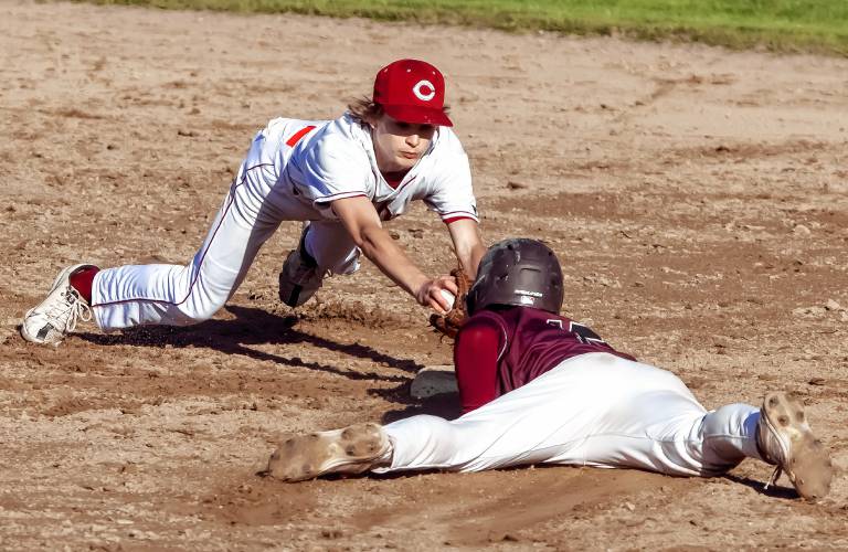 Concord second baseman attempts to tag Goffstown catcher Dillon Gaudet as he slides in safely on a steal during a May 10 contest at Memorial Field.