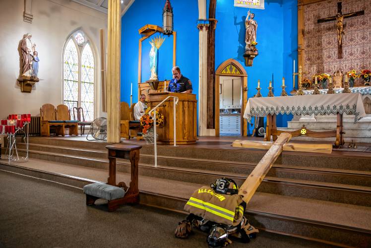 Allenstown firefighter/AEMT Ben Savage speaks at St. John the Baptist Catholic Church during the 9/11 Remembrance on Wednesday, Sept  11th, 2024. Besides the short service, Savage helped ring the bells at the church at 9:03 to commerate the terrorist attack 23 years ago.

