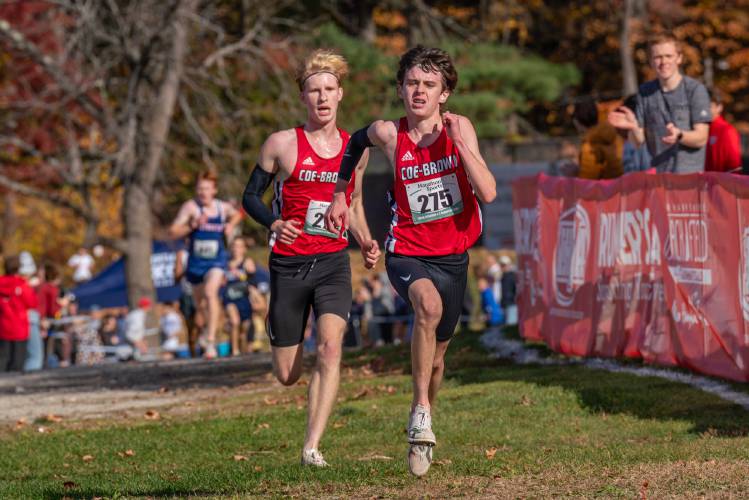 Coe-Brown Northwood Academy’s Patrick Youngs (275) and Luc Kerouac race towards the finish line in the NHIAA Division II cross country championship at Derryfield Park in Manchester on Saturday. Youngs and Kerouac finished third and fourth, respectively, to lead Coe-Brown to second place as a team. This marks the 11th straight season that the CBNA boys have finished in the top two of the division.