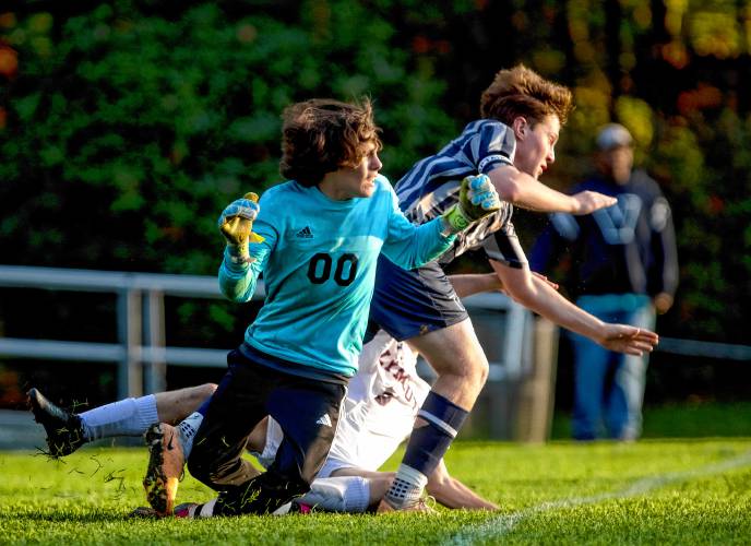 Merrimack Valley goalie Jacob Baggett watches the ball go into the net after he and teammate Owen Piper collide with Plymouth midfielder Dylan Webster during the second half on Tuesday, October 24, 2023. The Tide lost, 3-0.