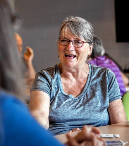 Pam McClintock talks with friends while playing Cribbage at the Concord Community Center on Monday morning, July 22, 2024.