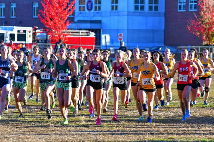 Concord’s Gianna Gualtieri (330) and Quinn Doherty (325), and Bow’s Hannah Pawlowski (315) take off from the starting line at the 47th Capital Area Cross Country Championship on Oct. 17 at Merrimack Valley High School.