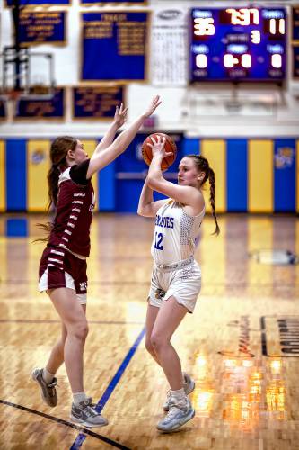 Franklin sophomore Kourtney Kaplan (12) gets ready to shoot a 3 during a home game on Jan. 13. Kaplan was named the Division IV Player of the Year.