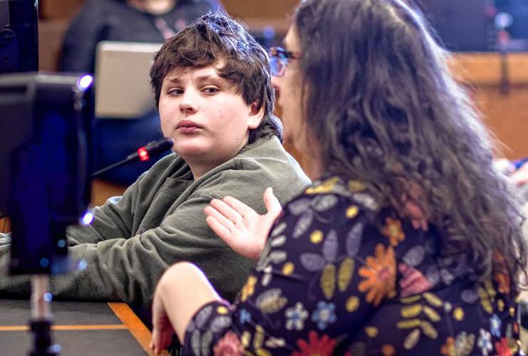 Luke Boisvert looks over at his mother, Jennifer, as she testifies against HB 377, which would ban puberty blockers and hormone therapy for minors. Luke does not need puberty blockers becuase of a pre-existing condition called Turner syndrome, meaning some DNA is missing from one of his X chromosomes.
