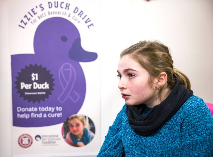 Izzie Boom and her duck drive poster to find a cure for Rhett’s Syndrome.