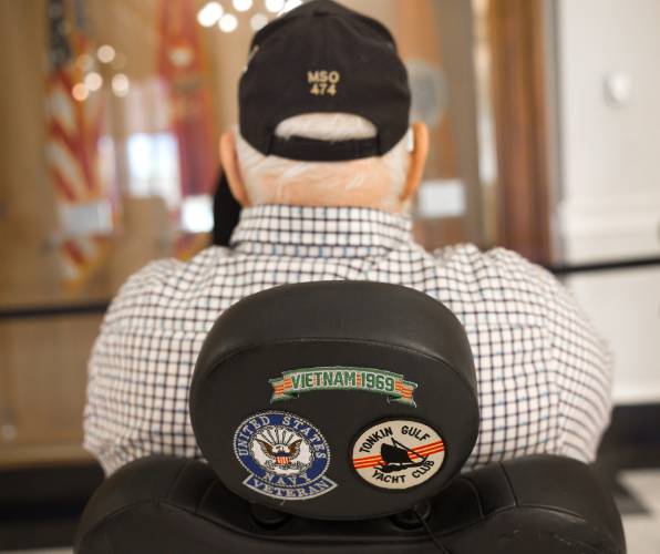 The back of Gary Gordon's wheelchair with the emblems from his service in Vietnam.
