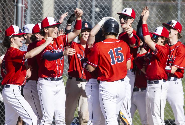 John Stark teammates greet Joey Dykstra after his home run against Pembroke on Wednesday. The Generals jumped to a 6-0 lead and saw it evaporate before locking down a 7-6 victory over the Spartans.