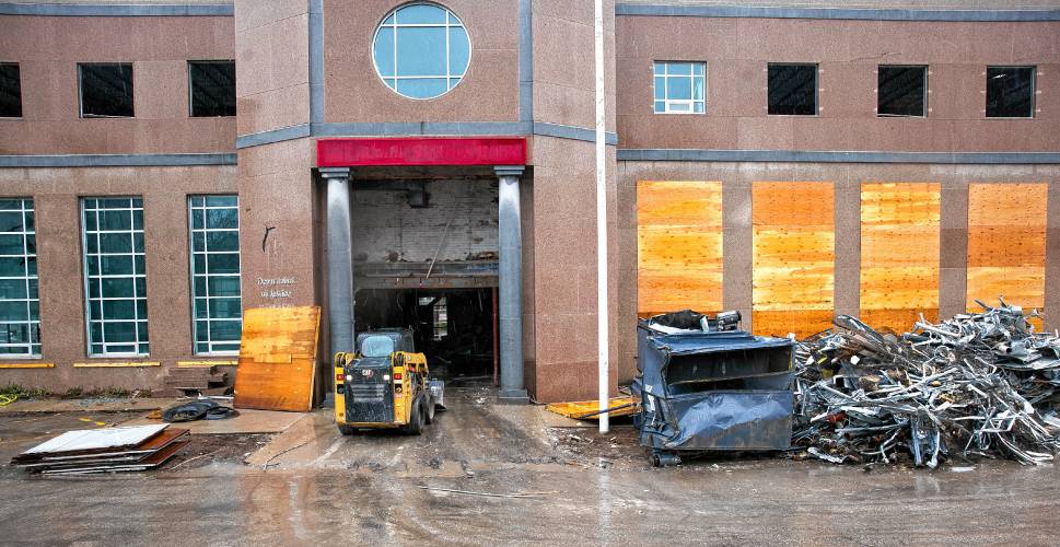 The demolition of the former Department of Justice building on North State Street is proceeding with piles of materials gathered outside the structure on Capitol Street side on Thursday, March 7, 2024.