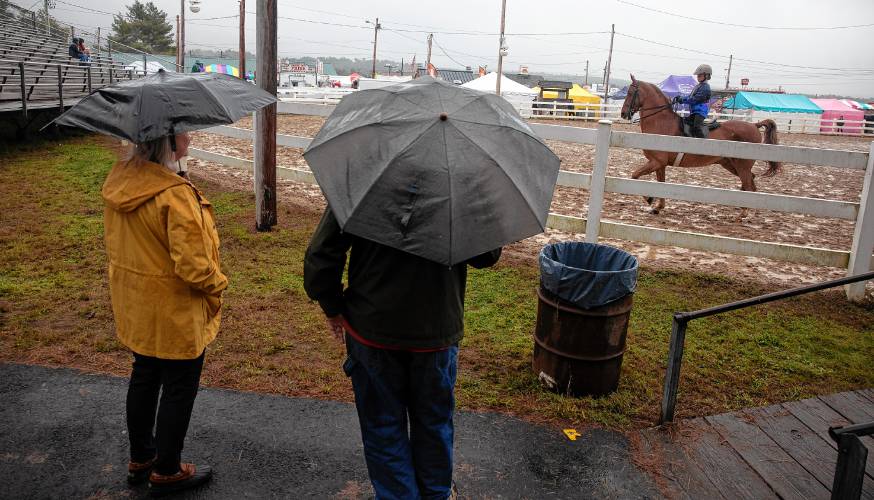 People watch a horse competition through the raindrops on the opening day of the Deerfield Fair on Thursday, September 26, 2024. The fair runs through Sunday.
