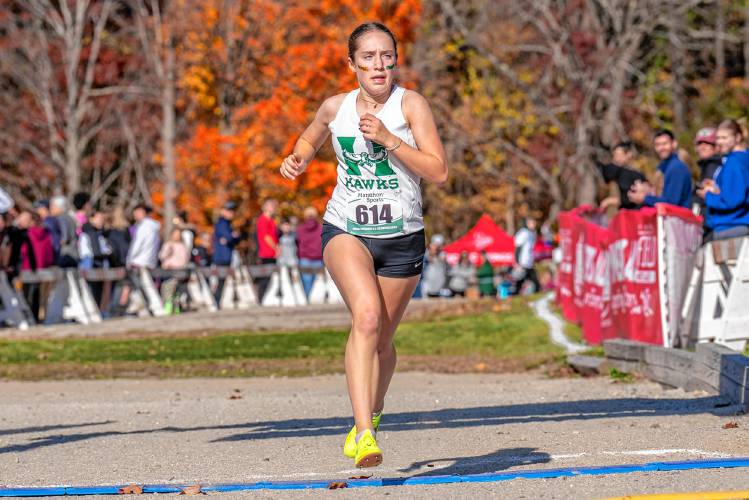 Hopkinton’s Maddy Lane races towards the finish line at Derryfield Park in Manchester at the NHIAA Division III cross country championship on Saturday. Lane defended her individual title, helping Hopkinton win its fourth D-III team championship in five years.