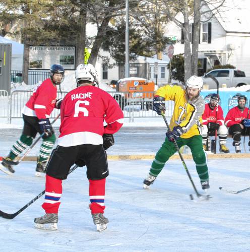 Concord Turnkeys got a shot off against Team Grappone as the sun set on the first day of the pond hockey tournament and a bonfire was lit for spectators to stay warm.