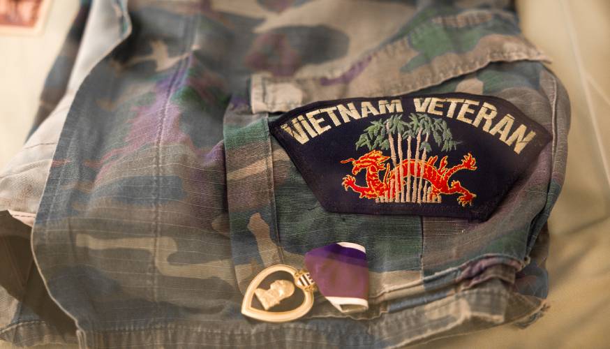 A Vietnam-era uniform is in the State Archives, as noted by archivist Ashley Miller. It is part of the Vietnam War 50th Anniversary display at the Hall of Flags in the State House on Wednesday, April 30, 2025.