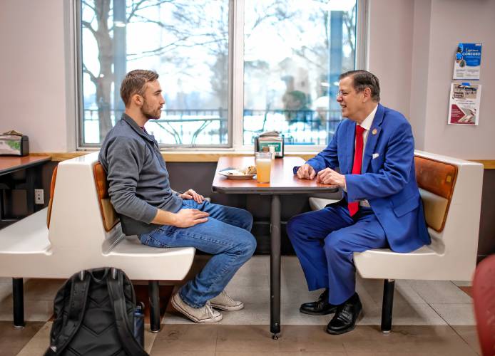 Dr. Patrick Tompkins, president of NHTI-Concord, talks with student RA George Hoffman in the cafeteria at the campus on Friday, February 9. Tompkins has been at the institution for a full year after coming from Virginia in 2023.