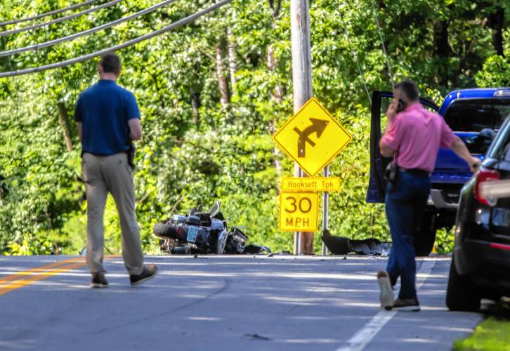 A motorcycle rests in the middle of Clinton Street near the Hooksett Turnpike intersection in Concord on Tuesday morning, July 16, 2024. The driver of the motorcycle was killed when it struck a blue pickup at right.