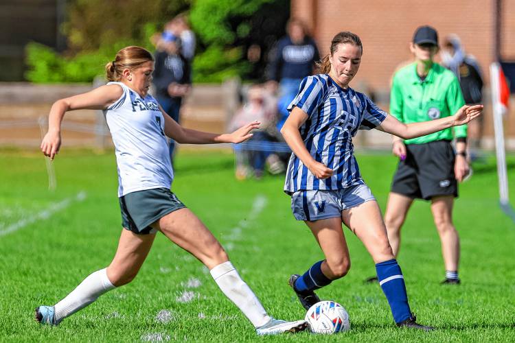 Pembroke’s Giannah Michelson (left) tackles Merrimack Valley’s defender Ellie Andrews.