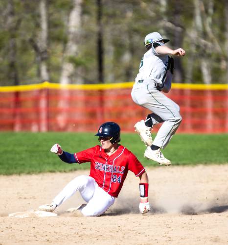 RIGHT: Pembroke second baseman Zachary Bemis (right) leaps over John Stark baserunner Aiden Harris as he slides in safely into the bag on Wednesday during the Generals’ 7-6 victory over the Spartans.