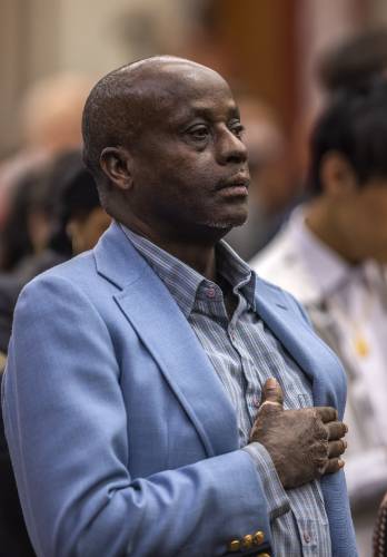 Kayitani Ndutiye gets sworn in as a United States citizen last Friday in a ceremony at the Federal Court in Concord, days before the New Hampshire primary.