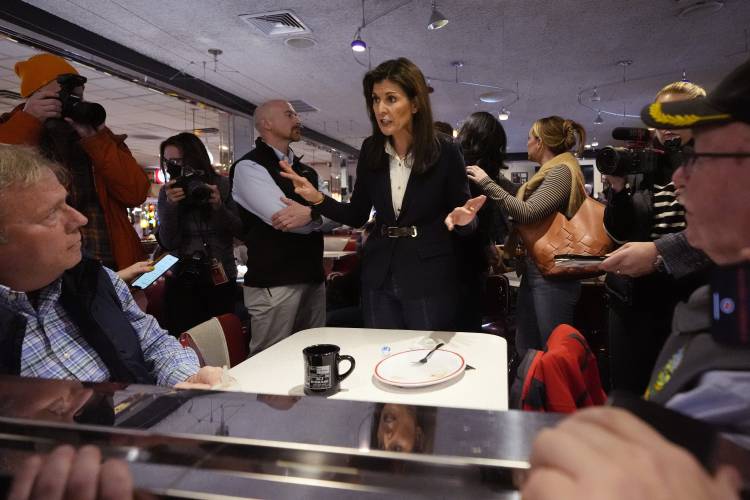 Republican presidential candidate and former UN Ambassador Nikki Haley, center, chats with guests during a campaign stop at Mary Ann's Diner on Jan. 19 in Amherst, N.H. Republican presidential candidate and former UN Ambassador Nikki Haley, center, chats with guests during a campaign stop at Mary Ann's Diner on Jan. 19 in Amherst, N.H.