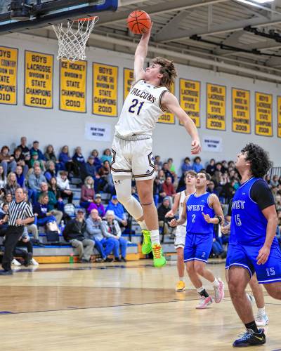 Bow’s Peyton Larrabee dunks against Manchester West on Tuesday at Bow High School. Bow defeated West, 58-44. 