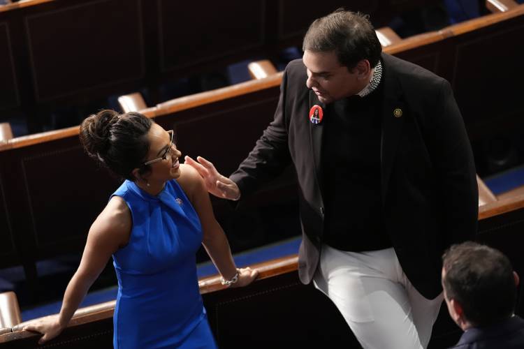 Rep. Lauren Boebert, R-Colo., and former Rep. George Santos, R-N.Y., talk before President Joe Biden delivers the State of the Union address to a joint session of Congress at the U.S. Capitol, Thursday March 7, 2024, in Washington. (AP Photo/Andrew Harnik)