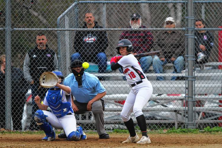 Coe-Brown sophomore Addison Coffin takes a pitch high during Wednesday's 6-0 win over Sanborn. May 8, 2024.