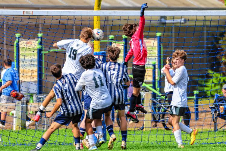 Pembroke’s Will Lecain heads the ball into the net to score the only goal of the match against Merrimack Valley on Saturday.