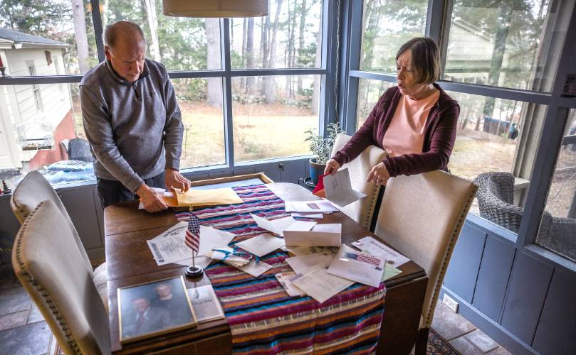 Jack and Linda Dianis pack up the letters that have been collected for Jack’s father, John, as they prepare for his Honor Flight to Washington.