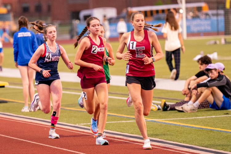 Concord’s Shelly Smith (2) races alongside Phillips Exeter's Ava Bullock (1) in the 5,000 meters at the inaugural NH Distance Festival at Souhegan High School on Friday. Smith’s time of 18 minutes, 16 seconds is the 28th fastest high school time in the nation this season and qualified Smith for the Nike Outdoor National Championships in June.