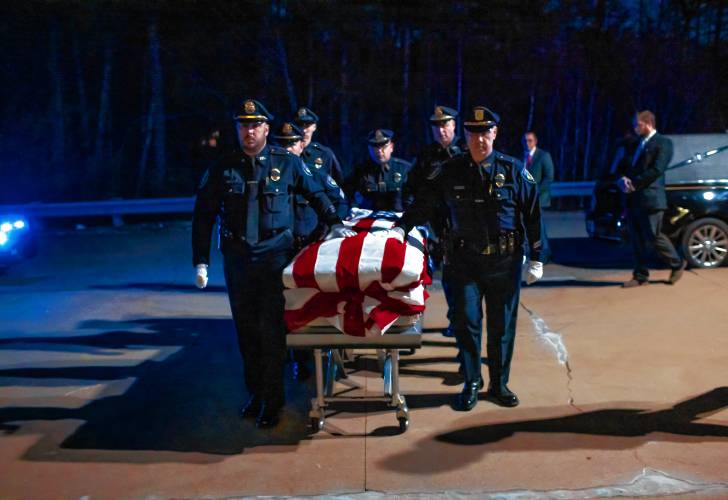 Members of the Franklin Police Department escort the casket of Former Police Chief Bradley Haas into the service at Winnisquam High School on Monday, November 27, 2023.