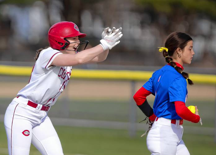 Concord catcher Delaney Duford claps at her teammates in the dugout after hitting a double in the bottom of the first inning on Wednesday, April 17, 2024. Concord went on to win against Winnacunnet, 3-2.