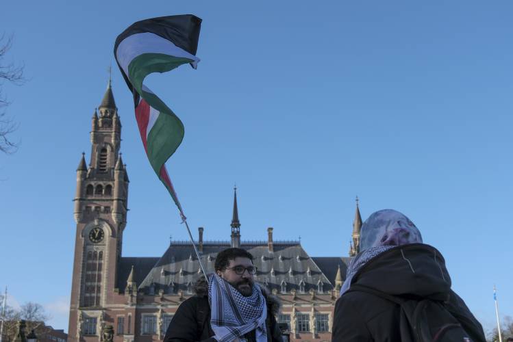 Protesters gather outside the Peace Palace, which houses the International Court of Justice, or World Court, in The Hague, Netherlands, Friday, Jan. 26. Protesters gather outside the Peace Palace, which houses the International Court of Justice, or World Court, in The Hague, Netherlands, Friday, Jan. 26.