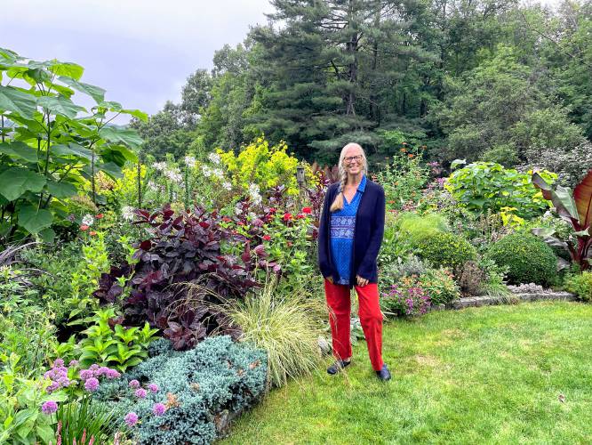 Laura Trowbridge of Peterborough, a landscape designer, in her mixed border. 