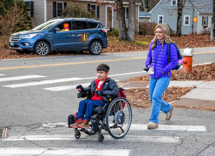 Bodhi Bhattarai travels home with his sister, Devi, and their nanny Lydon Flanagan as they get out from Broken Ground Elementary School.