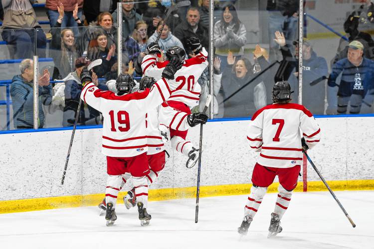 Senior forward Trevor Craigue (20) celebrates his goal in the third period with the numerous Concord fans in attendance at JFK Coliseum on Wednesday afternoon.