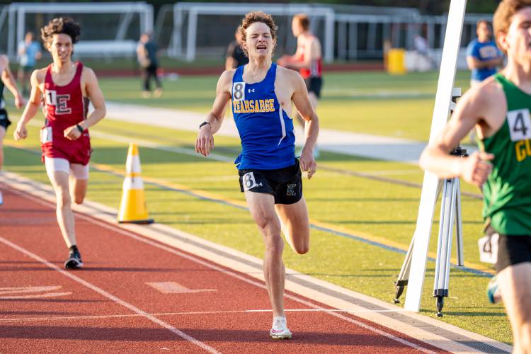 Kearsarge’s Daniel Dalbec crosses the finish line to finish second in the 1 mile race at the inaugural NH Distance Festival at Souhegan High School on Friday. Dalbec finished second out of more than 70 competitors.