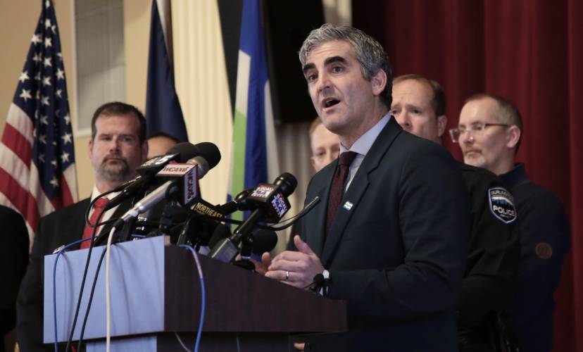 Burlington Mayor Miro Weinberger, surrounded by police and city officials, speaks at a news conference in Burlington, Vt., on Monday, Nov. 27, 2023, about the shooting of three college students of Palestinian descent. A suspect, Jason Eaton, 48, pleaded not guilty to attempted murder Monday in connection with the weekend shooting, which is being investigated as a possible hate crime. (AP Photo/Hasan Jamali)