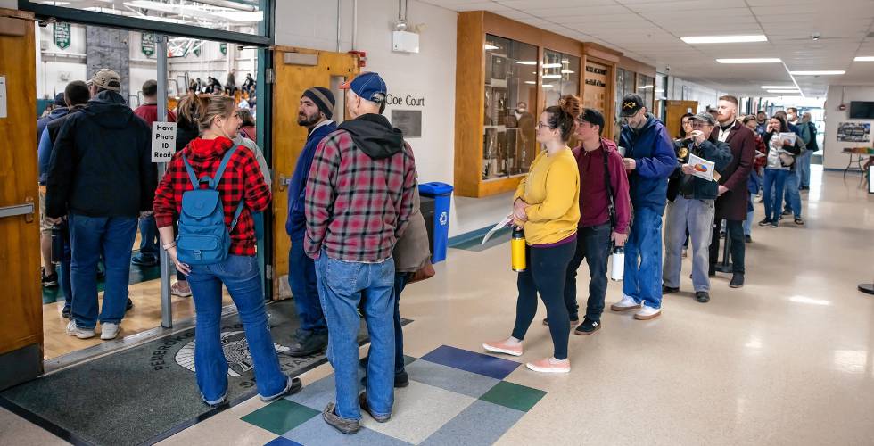 The line to register at the Pembroke School District Meeting went out the gymnasium door and down the hallway before the meeting could start on Saturday, March 9, 2024.