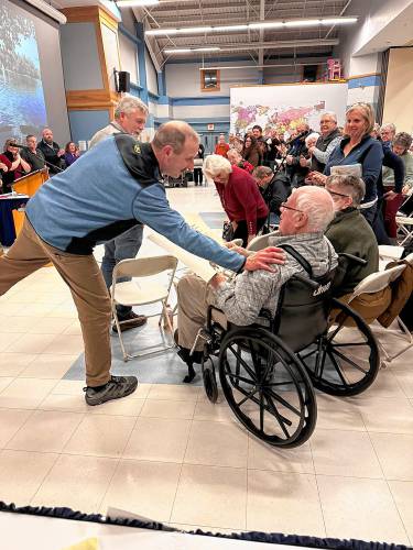 Edward Cherian Jr., the chair of Boscawen’s Zoning Board of Adjustment, thanks Roger Sanborn, who was honored at Town Meeting on March 12 with a standing ovation. Edward Cherian Jr., the chair of Boscawen’s Zoning Board of Adjustment, thanks Roger Sanborn, who was honored at Town Meeting on March 12 with a standing ovation.