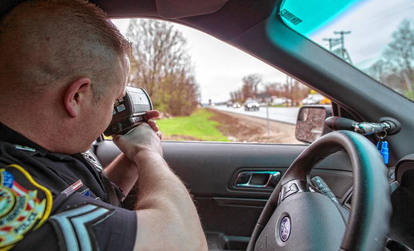 Chichester police corporal Josh Wright aims the hand held speed equipment on the eastbound lane of Route 4 in Chichester on Friday, May 3, 2019. Chichester police corporal Josh Wright aims the hand held speed equipment on the eastbound lane of Route 4 in Chichester on Friday, May 3, 2019.