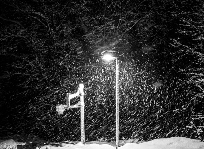 The snow was still coming down hard outside the Dunbarton Elementary School where the town meeting was being held on Tuesday night, March 14, 2023. Around 30 people attended the meeting despite the reported 26 inches of snow that hit the town. The snow was still coming down hard outside the Dunbarton Elementary School where the town meeting was being held on Tuesday night, March 14, 2023. Around 30 people attended the meeting despite the reported 26 inches of snow that hit the town.