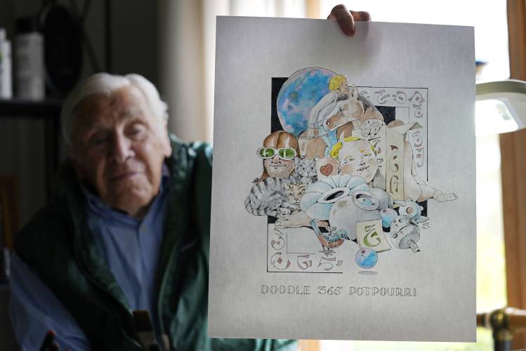 Artist Robert Seaman holds up the 365th daily doodle sketch in his room at an assisted living facility Monday, May 10, 2021, in Westmoreland, N.H. Seaman, who moved into the facility weeks before the COVID-19 pandemic shutdown his outside world in 2020, recently completed his 365th daily sketch, or what he calls his 