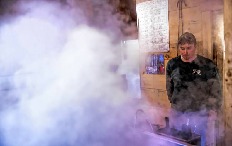 Wille Matras of Matras Maple Sugarhouse in Pittsfield checks on the water content of sap as he and family boil for syrup on Monday, March 10, 2025. The sugarhouse will be open this weekend for the New Hampshire Maple Weekend. To learn more, go to their website at https://www.matrasmaple.com/