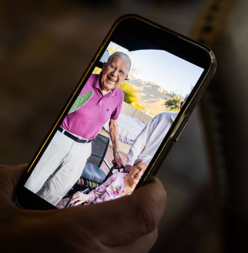 Jack Dianis holds a photo of his father, John, as he prepares for his Honor Flight to Washington.