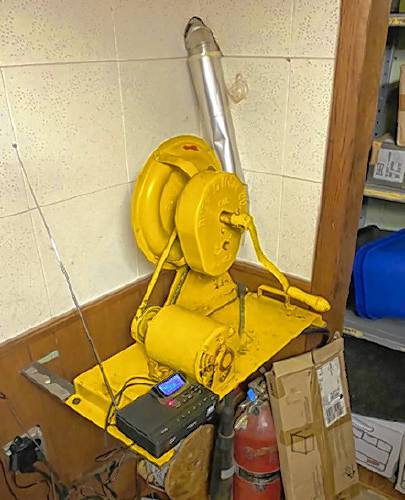 This device in the corner of what was originally a bomb shelter in the basement of the WKXL studios in Concord, is an air filtration system installed at the behest of the federal government during the Cold War in the mid 1960s. Presumably it would filter out contaminants left by Soviet attack, allowing people in the shelter to breathe safely. The shelter is now used as a storage area.