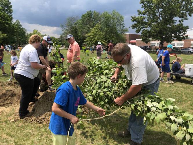 Pictured in June 2023, students at Abbot-Downing School in Concord help to plant trees donated by the state’s Division of Forests and Lands. 